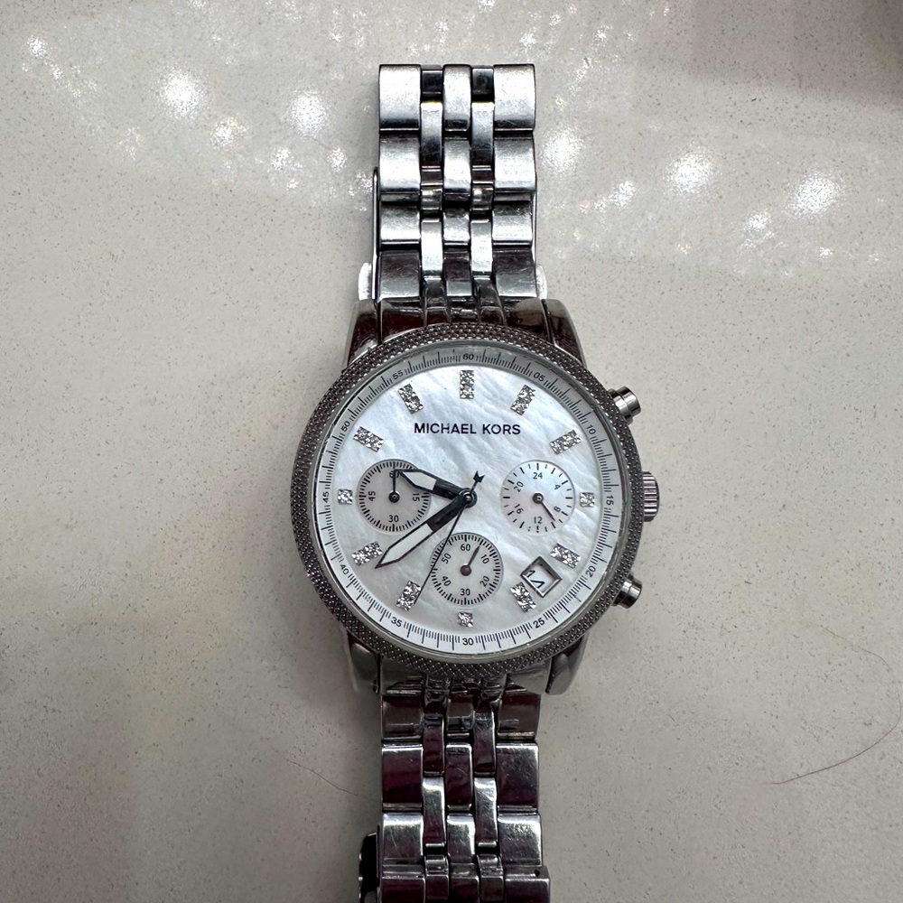 Michael Kors silver watch.  Needs batteries.